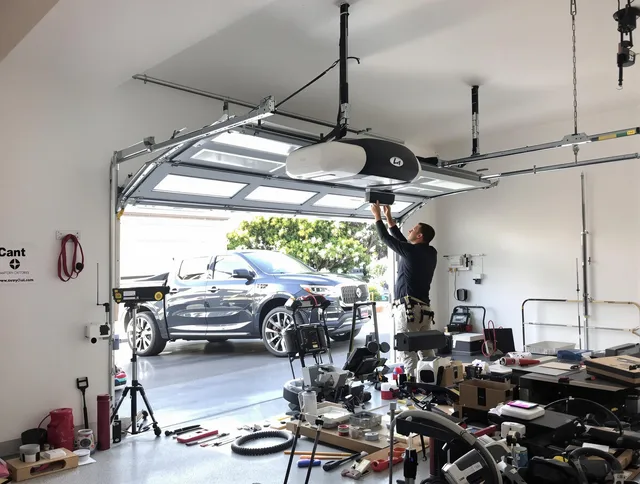 Miami Beach Garage Door Repair specialist installing smart garage door opener system in Miami Beach home